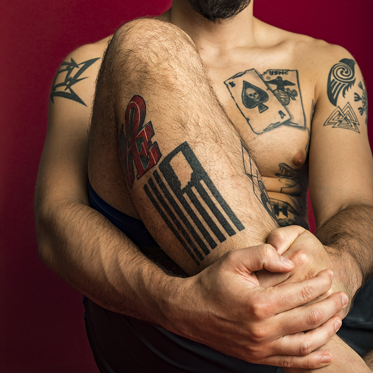 An IUPUI student poses for the Military Tattoo Project